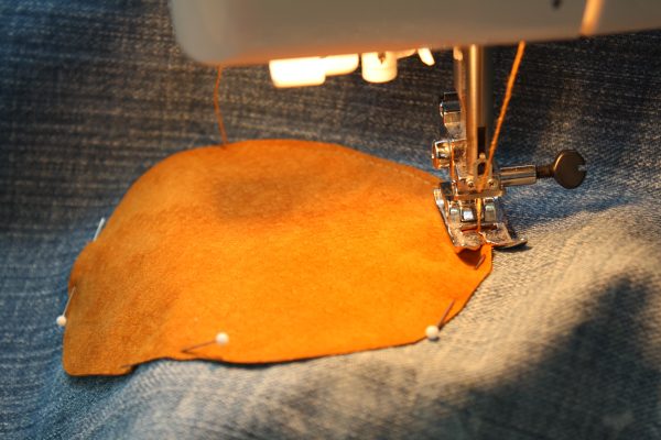 Toddler pants made from an old pair of jeans with knee patches added for longevity