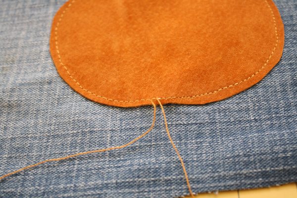 Toddler pants made from an old pair of jeans with knee patches added for longevity