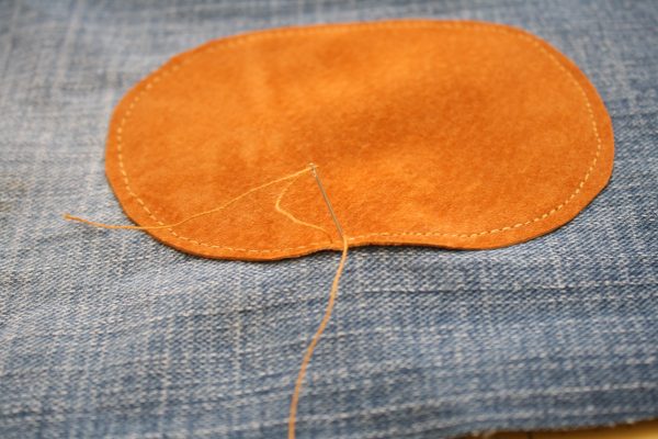 Toddler pants made from an old pair of jeans with knee patches added for longevity
