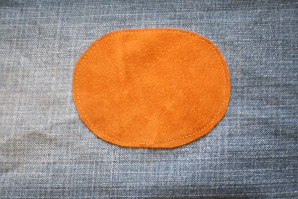 Toddler pants made from an old pair of jeans with knee patches added for longevity