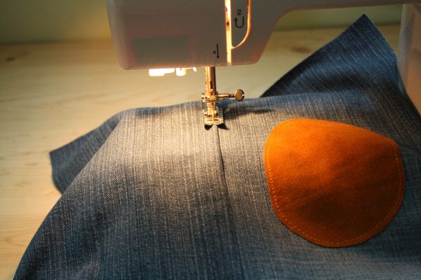 Toddler pants made from an old pair of jeans with knee patches added for longevity
