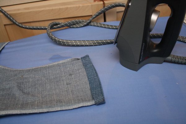 Toddler pants made from an old pair of jeans with knee patches added for longevity