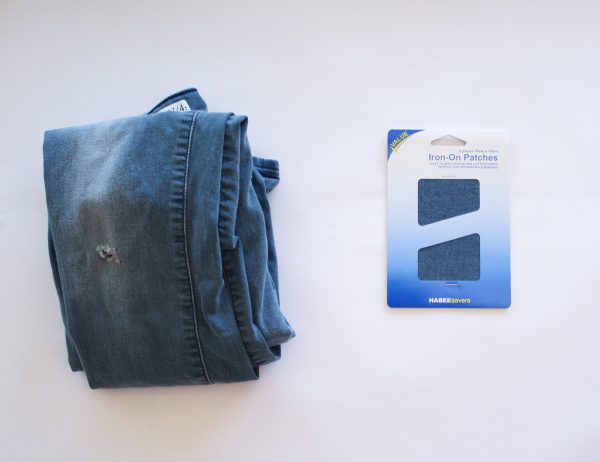 Iron on knee patches to fix a pair of jeans with a hole in the knee