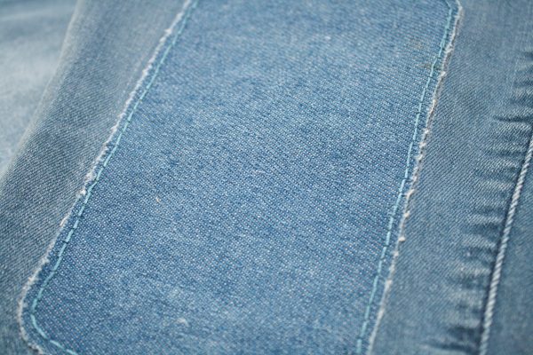 Hand sewing iron on knee patches makes them last longer