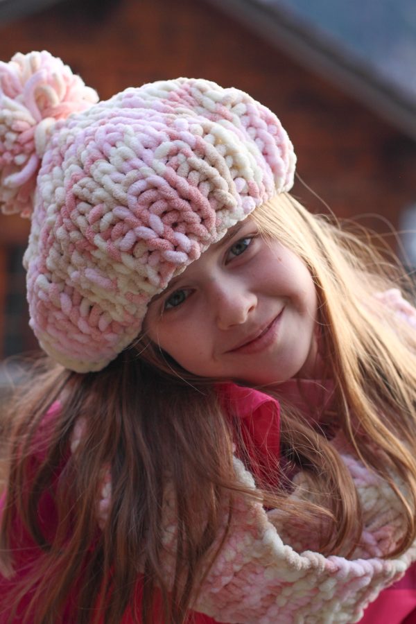 Birdie wearing a scarf she knitted with matching hat knitted by her Ouma